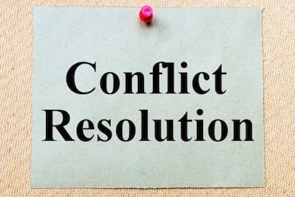 Conflict Resolution Through High-Level Negotiation